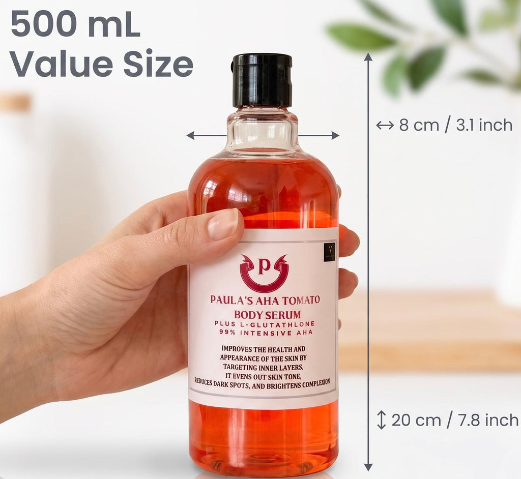A hand holds a 500 mL bottle of Paula's AHA Tomato Body Serum, showing its dimensions of 8 cm in height and 20 cm in width. The bottle contains a vibrant orange-red liquid and has a white label with red text and logo.