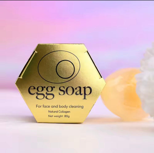 Gold hexagonal egg soap packaging with a soft focus background