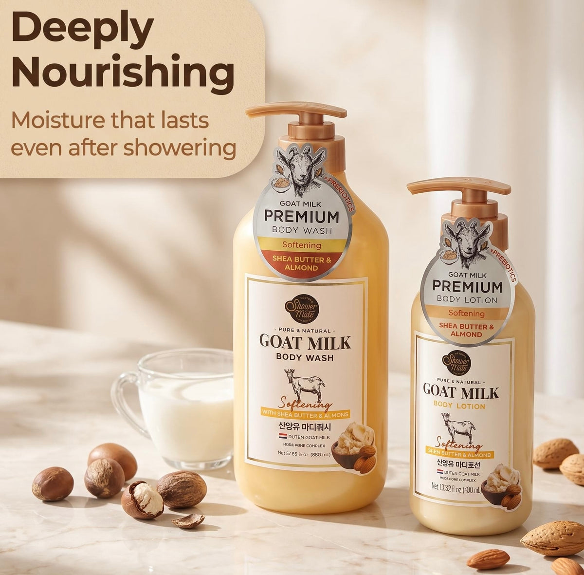 Two bottles of Goat Milk Premium Body Wash in Shea Butter & Almond scent are displayed on a marble surface with scattered almonds and a glass of milk. The larger bottle is in the center, and a smaller one stands to the right.