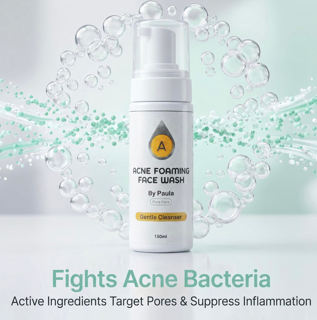 A white pump bottle of Acne Foaming Face Wash by Paula, centered against a light mint-green background with floating bubbles and text overlays.