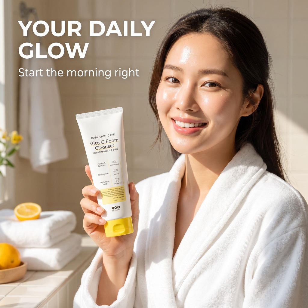 A woman in a white bathrobe holds up a tube of Eco-Cure Vita C Foam Cleanser in a bright bathroom setting. The text 'YOUR DAILY GLOW Start the morning right' is displayed in the upper left corner.