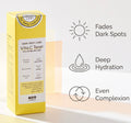 A yellow box of Soo Beruby Vita C Toner Dark Spot Care stands on a white surface against a light beige background. To the right are three black line icons with text: a sun reading 'Fades Dark Spots,' a water droplet reading 'Deep Hydration,' and a circular arrow reading 'Even Complexion.