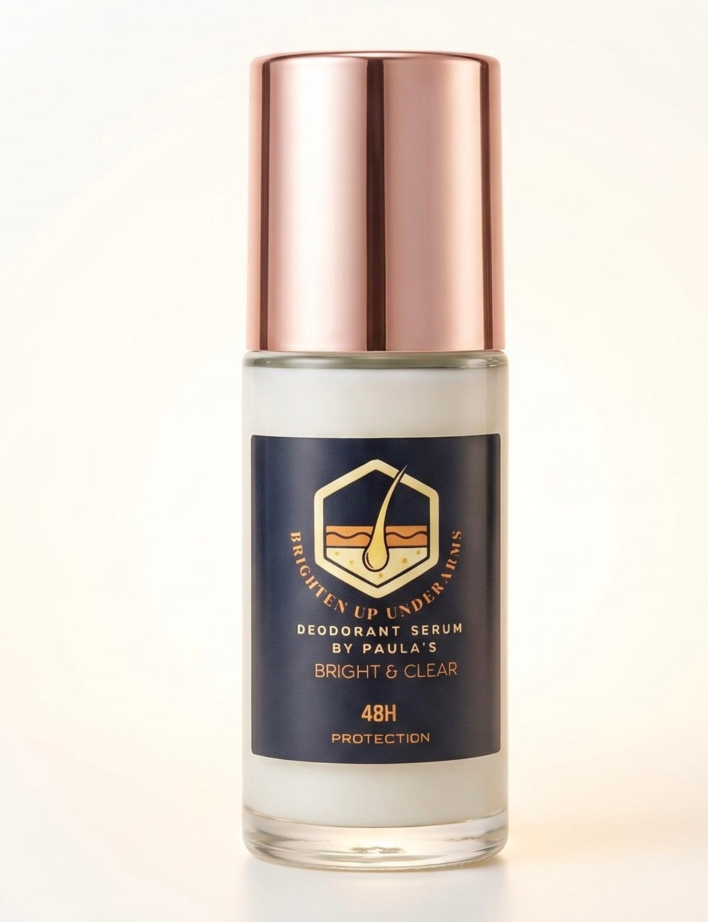 A bottle of Paula's Brighten Up Underarms Deodorant Serum with a metallic rose gold cap and a navy blue label, shown on a clean white background.