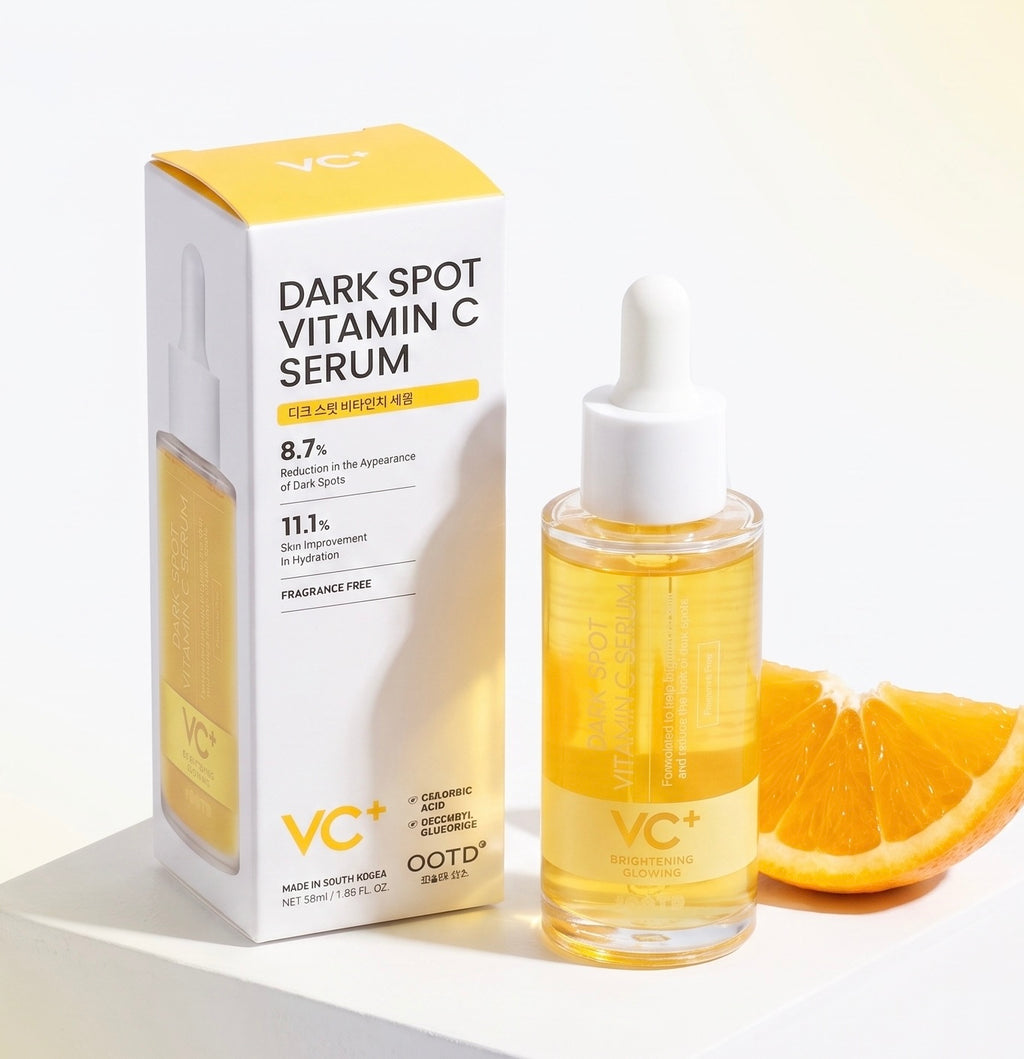 VC+ Dark Spot Vitamin C Serum shown with its white and yellow retail box and a clear dropper bottle filled with golden-yellow serum, styled with orange slices on a clean white background.