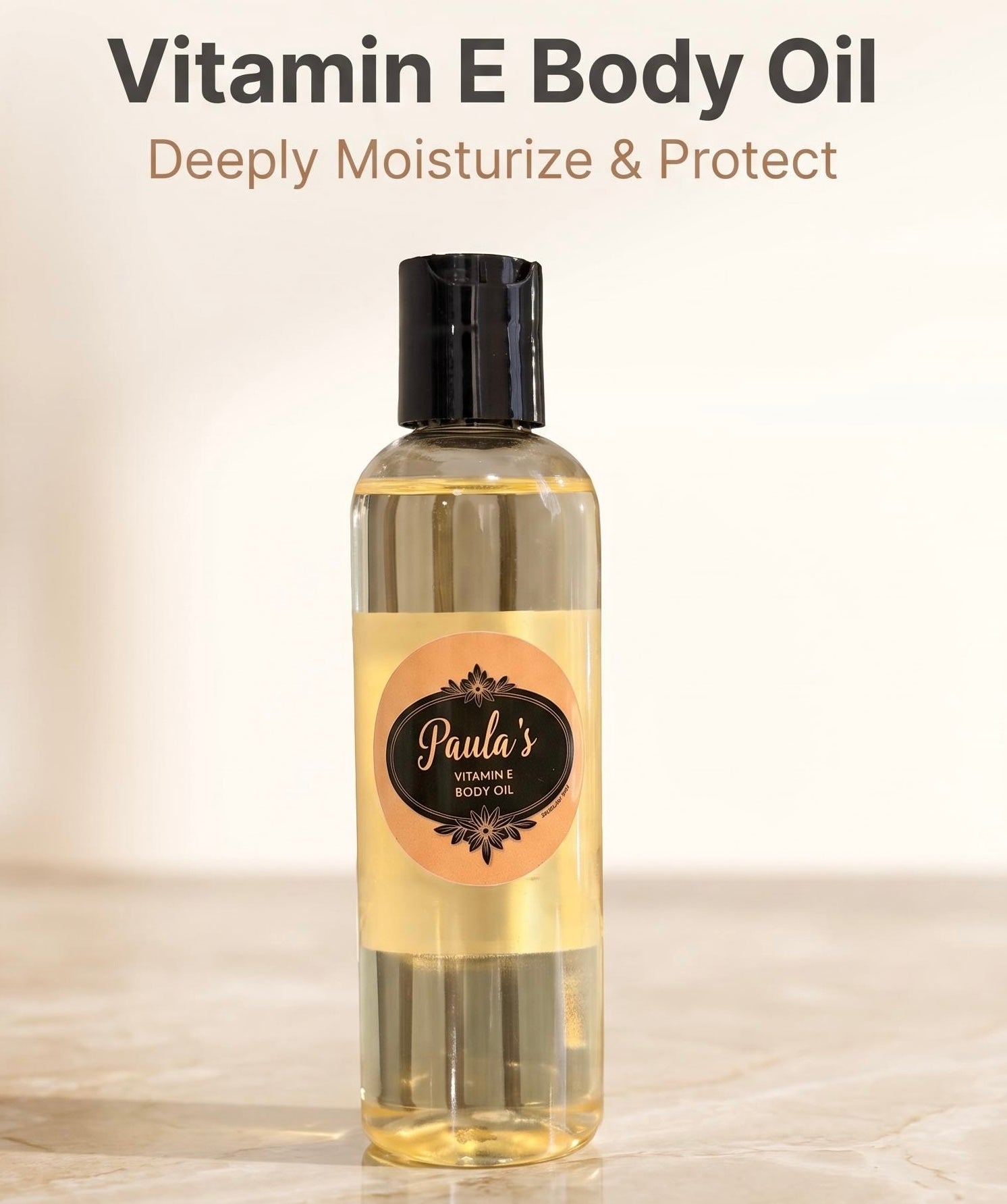 A bottle of Paula's Vitamin E Body Oil with a black cap and a peach and black label, set against a warm beige background with promotional text at the top.
