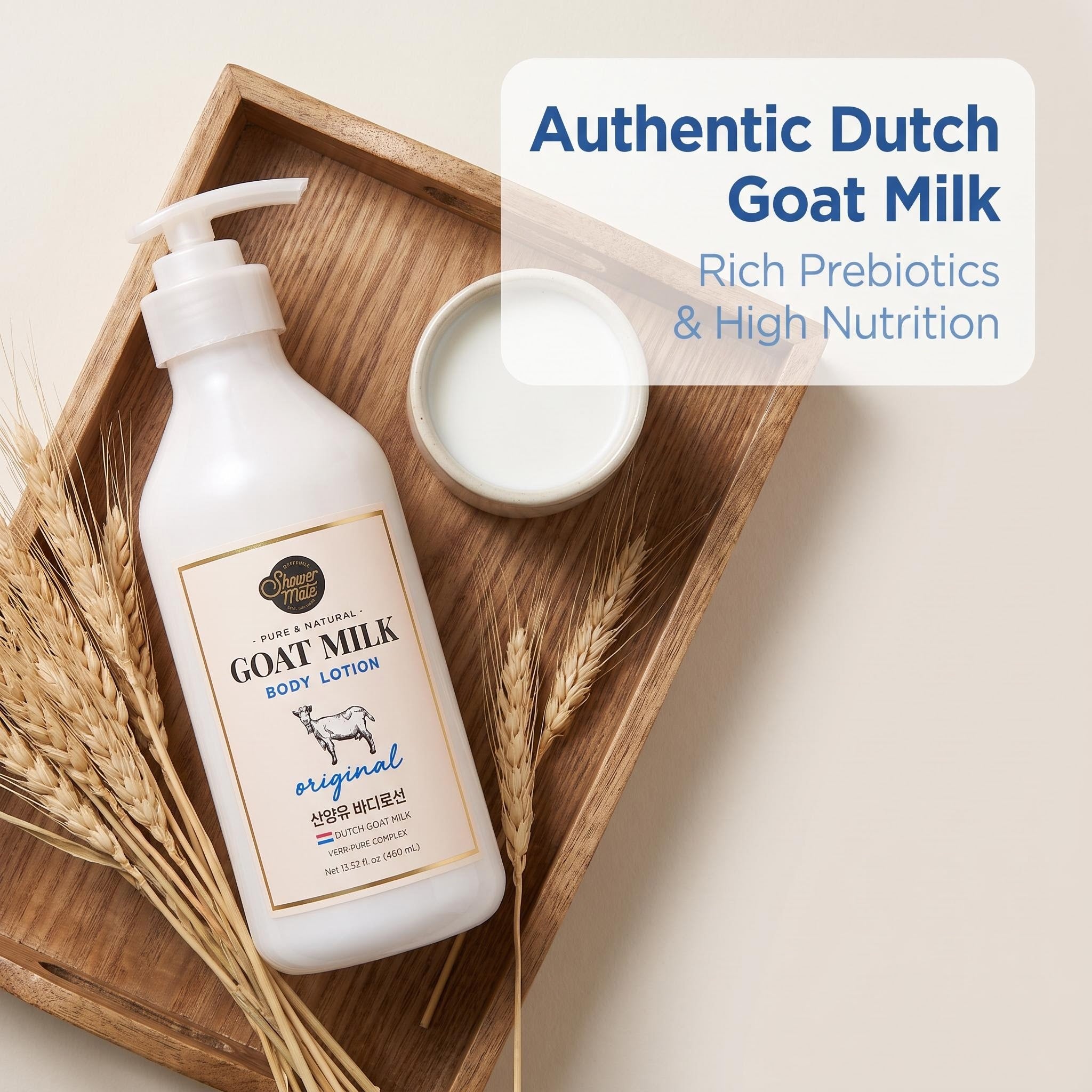 A bottle of goat milk body lotion sits on a wooden tray with wheat stalks and a small dish of white lotion. Text on the image reads 'Authentic Dutch Goat Milk, Rich Prebiotics & High Nutrition.